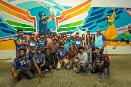 LSG captain KL Rahul with supporters against a wall painting in Lucknow LSG captain KL Rahul with supporters against a wall painting in Lucknow