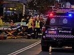 Stretchers outside Westfield Shopping Centre where multiple people were stabbed in Sydney on Saturday.