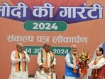 Prime Minister  Narendra Modi, BJP president JP Nadda and other senior leaders at the release of Sankalp Patra for Lok Sabha elections 2024 at BJP headquarters in New Delhi on Sunday. (Ajay Aggarwal/HT photo)