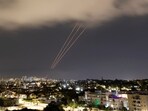 An anti-missile system operates after Iran launched drones and missiles towards Israel, as seen from Ashkelon, Israel 