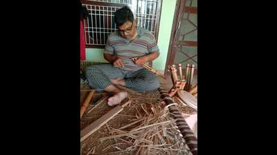 A flute maker at work in Pilibhit and flutes (HT Photo)