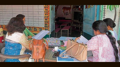 Government school teachers making assessment sheets for students under Mission Samrath. (HT File Photo) Government school teachers making assessment sheets for students under Mission Samrath. (HT File Photo)