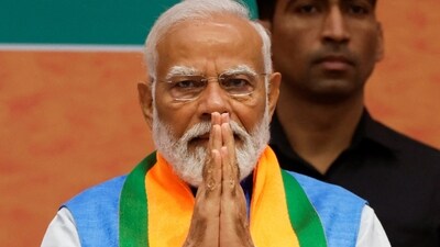 PM Narendra Modi greets attendees during the event to launch the ruling Bharatiya Janata Party’s (BJP) election manifesto for the general election in New Delhi. (REUTERS)