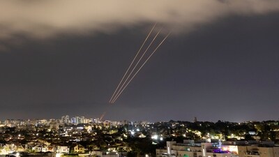 An anti-missile system operates after Iran launched drones and missiles towards Israel, as seen from Ashkelon, Israel (REUTERS)