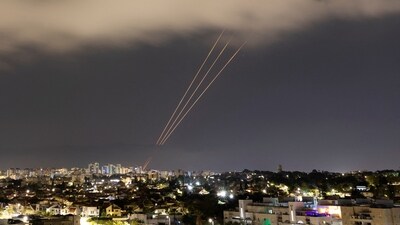 An anti-missile system operates after Iran launched drones and missiles towards Israel, as seen from Ashkelon, Israel (REUTERS)