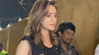 Kriti Sanon pulled off a rockstar chic outfit in a gold and black graphic t-shirt and ripped shorts. Kriti Sanon pulled off a rockstar chic outfit in a gold and black graphic t-shirt and ripped shorts.
