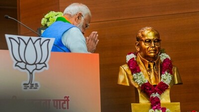 PM Narendra Modi pays tribute to BR Ambedkar during the release of the party's election manifesto ‘Sankalp Patra’ at the party headquarters, in New Delhi on Sunday. (PTI) PM Narendra Modi pays tribute to BR Ambedkar during the release of the party's election manifesto ‘Sankalp Patra’ at the party headquarters, in New Delhi on Sunday. (PTI)