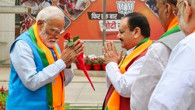 Prime Minister Narendra Modi being greeted by BJP National President JP Nadda on his arrival for the release of party's election manifesto. (PTI) Prime Minister Narendra Modi being greeted by BJP National President JP Nadda on his arrival for the release of party's election manifesto. (PTI)