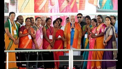 Prime Minister Narendra Modi wasg presented a shawl by BJP women wing leaders during an election campaign rally ahead of Lok Sabha election, in Mysuru, on Sunday. (PTI) Prime Minister Narendra Modi wasg presented a shawl by BJP women wing leaders during an election campaign rally ahead of Lok Sabha election, in Mysuru, on Sunday. (PTI)