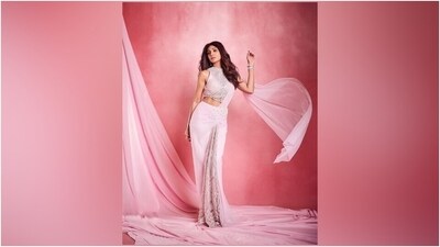 Shilpa accessorised the ensemble with a bracelet, heels, and dangling earrings. Lastly, she chose smoky eye shadow, winged eyeliner, mascara on the lashes, on-fleek darkened brows, glossy pink lip shade, rouge on the cheeks, and centre-parted loose locks with soft waves for the glam picks. (Instagram) Shilpa accessorised the ensemble with a bracelet, heels, and dangling earrings. Lastly, she chose smoky eye shadow, winged eyeliner, mascara on the lashes, on-fleek darkened brows, glossy pink lip shade, rouge on the cheeks, and centre-parted loose locks with soft waves for the glam picks. (Instagram)