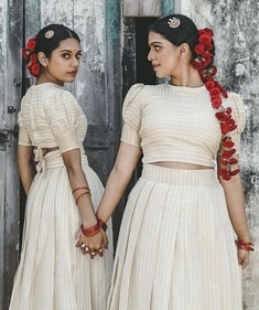Models adorn their hair with red roses for the festival donning pattu pavadais from Kilan Studio (Photo: Instagram) Models adorn their hair with red roses for the festival donning pattu pavadais from Kilan Studio (Photo: Instagram)