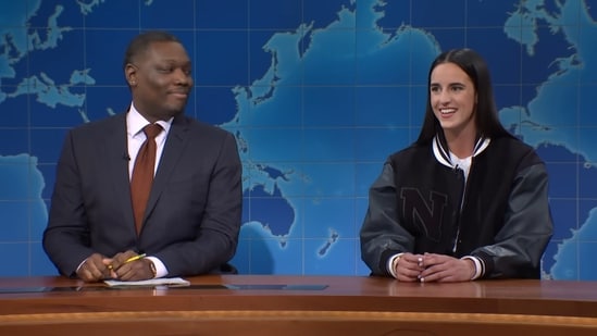 Michael Che and basketball champ Caitlin Clark on SNL's Weekend Update. (Saturday Night Live)