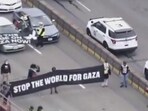 Several videos have surfaced online showing that pro-Palestine supporters are sitting in the center of Interstate 190 to block traffic from entering the main airport in Windy City. Several videos have surfaced online showing that pro-Palestine supporters are sitting in the center of Interstate 190 to block traffic from entering the main airport in Windy City.