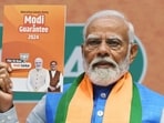 Prime Minister Narendra Modi releases the BJP election manifesto in New Delhi on Sunday. (ANI Photo)