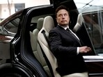 Tesla layoffs: Tesla Chief Executive Officer Elon Musk gets in a Tesla car as he leaves a hotel in Beijing, China.