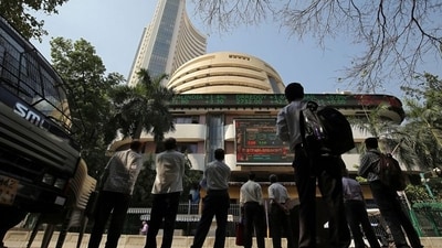 Ram Navami stock market holiday: People look at a screen displaying the Sensex results on the facade of the Bombay Stock Exchange (BSE) building in Mumbai. (Reuters)
