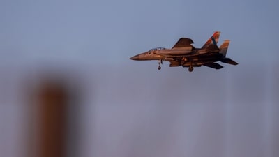 An Israeli army f-15 fighter jet flies over central Israel on April 15, 2024. (Photo by Menahem KAHANA / AFP) An Israeli army f-15 fighter jet flies over central Israel on April 15, 2024. (Photo by Menahem KAHANA / AFP)