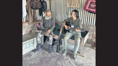 Inside the KNA camp, self-styled corporals Chungkholen (left) and Bosco singing a hymn. (Prawesh Lama/HT Photo)