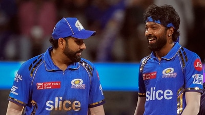 Mumbai Indians captain Hardik Pandya and Rohit Sharma during the IPL match against Royal Challengers Bengaluru (PTI) Mumbai Indians captain Hardik Pandya and Rohit Sharma during the IPL match against Royal Challengers Bengaluru (PTI)