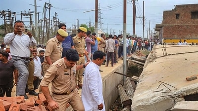 Rescue work underway after roof of an under-construction building collapsed, at Jansath in Muzaffarnagar district. (PTI)