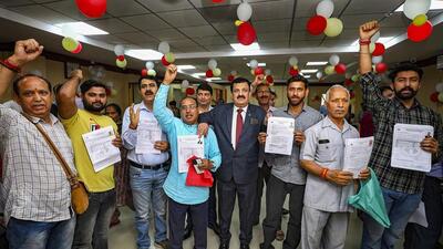 Pilgrims celebrating in Jammu on Monday after getting themselves registered for the Amarnath Yatra that begins on June 29. (PTI Photo) Pilgrims celebrating in Jammu on Monday after getting themselves registered for the Amarnath Yatra that begins on June 29. (PTI Photo)