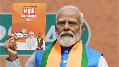 Prime Minister Narendra Modi releases the BJP election manifesto in New Delhi on Sunday. (ANI Photo)