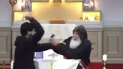 A man stabs Bishop Mar Mari Emmanuel during a church service at Christ The Good Shepherd Church in Wakeley, Sydney (Reuters)