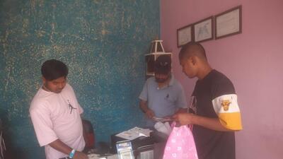 Villagers at a cyber cafe in Ramnagara village in Pilibhit district to submit applications meant for uploading on the citizenship portal. (HT Photo)