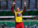 FILE - Mykolas Alekna, of Lithuania, celebrates
