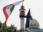 Iranian lift up a flag and the mock-up of a missile during a celebration following Iran's missiles and drones attack on Israel, on April 15 2024, at Palestine square in central Tehran. Iranian lift up a flag and the mock-up of a missile during a celebration following Iran's missiles and drones attack on Israel, on April 15 2024, at Palestine square in central Tehran.
