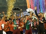 J Cummings and Petratos of Mohun Bagan SG celebrate after winning the match against Mumbai City FC and winning ISL Trophy at Salt Lake Stadium in Kolkata.