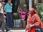 Mumbai, India - April 12, 2024: Pedestrian cover their face with dupatta while dealing with the rise of temperature at Dadar TT, in Mumbai, India, on Friday, April 12, 2024. (Photo by Anshuman Poyrekar/ Hindustan Times) (Hindustan Times) Mumbai, India - April 12, 2024: Pedestrian cover their face with dupatta while dealing with the rise of temperature at Dadar TT, in Mumbai, India, on Friday, April 12, 2024. (Photo by Anshuman Poyrekar/ Hindustan Times) (Hindustan Times)