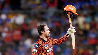 Sunrisers Hyderabad's Travis Head celebrates his century during the match against Royal Challengers Bengaluru in the Indian Premier League (IPL) 2024, at M.Chinnaswamy Stadium (IPL)