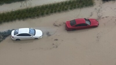 Cars are parked at a flooded street during a rain storm in Dubai, United Arab Emirates. (Reuters)