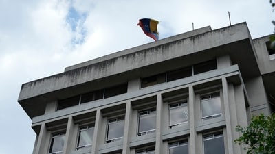 The Venezuelan flag flies over the building where the Venezuelan embassy is located in Quito, Ecuador. (AP) The Venezuelan flag flies over the building where the Venezuelan embassy is located in Quito, Ecuador. (AP)