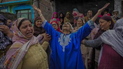 Family members mourning after a boat capsized in the Jhelum river on the outskirts of Srinagar on Tuesday. (AP Photo) Family members mourning after a boat capsized in the Jhelum river on the outskirts of Srinagar on Tuesday. (AP Photo)