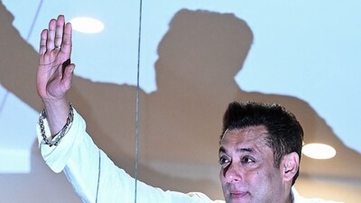 Bollywood actor Salman Khan greets fans gathered outside his residence on the occasion of Eid al-Fitr on April 11, 2024. (AFP)