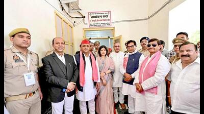 Samajwadi Party candidate for Mainpuri, Dimple Yadav, accompanied by her husband and former UP CM Akhilesh Yadav, Samajwadi Party general secretary Ram Gopal Yadav and party leader Shivpal Yadav poses for a photo after filing her nomination papers for the Lok Sabha elections, in Mainpuri on Tuesday. (ANI Photo)