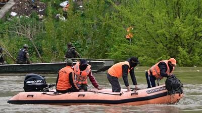 Search operations underway in Jhelum near Jammu and Kashmir’s Gandbar after a boat capsized in the river. (Waseem Andrabi /HT) Search operations underway in Jhelum near Jammu and Kashmir’s Gandbar after a boat capsized in the river. (Waseem Andrabi /HT)