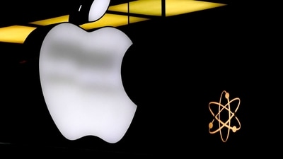 The Apple logo is illuminated at a store. (AP) The Apple logo is illuminated at a store. (AP)
