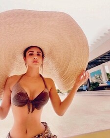 Mouni Roy goes oversize with her hat (Instagram) Mouni Roy goes oversize with her hat (Instagram)