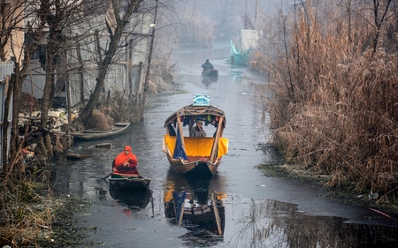 Srinagar: 'Shikara-wallas' row their boats through partially frozen Dal Lake, in Srinagar, Thursday, Dec. 21, 2023. The 40-day harshest winter period in Kashmir, known as Chillai Kalan, began from Thursday. (PTI Photo) (PTI12_21_2023_000137A) (PTI) Srinagar: 'Shikara-wallas' row their boats through partially frozen Dal Lake, in Srinagar, Thursday, Dec. 21, 2023. The 40-day harshest winter period in Kashmir, known as Chillai Kalan, began from Thursday. (PTI Photo) (PTI12_21_2023_000137A) (PTI)