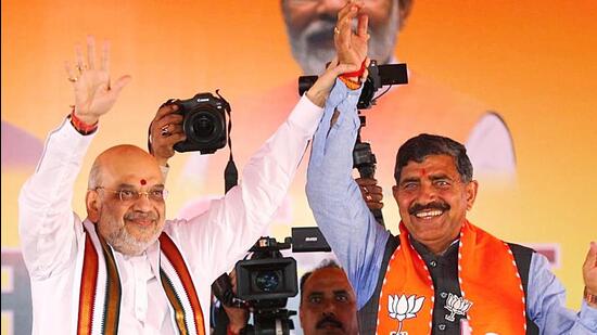 Union home minister Amit Shah and BJP’s Jammu candidate Jugal Kishore Sharma addressing a gathering in Jammu. (Gourav)