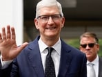 Apple CEO Tim Cook waves to journalists after his meeting with Indonesian President Joko Widodo at the Presidential Palace in Jakarta, Indonesia.