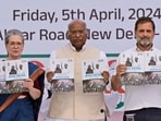 FILE- India’s opposition Congress party leaders from left, Sonia Gandhi, Mallikarjun Kharge, and Rahul Gandhi, display copies of party’s election manifesto during a press conference in New Delhi, India, April 5, 2024. India's 6-week-long general election starts on April 19 and results will be announced on June 4. (AP Photo/Manish Swarup, File)