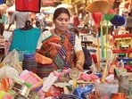 Mrs. Komal Bongode, a hawker who sells plastic items, also her son sits with her near her stall and studies at Mathuradas road, Kandivali West, Mumbai, India on Thursday, January 24, 2013. Photo by - Vidya Subramanian /Hindustan Times. (Hindustan Times) Mrs. Komal Bongode, a hawker who sells plastic items, also her son sits with her near her stall and studies at Mathuradas road, Kandivali West, Mumbai, India on Thursday, January 24, 2013. Photo by - Vidya Subramanian /Hindustan Times. (Hindustan Times)