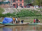 Rescuers searching for missing persons in Jhelum river near Gandbal, Kashmir. (PTI) Rescuers searching for missing persons in Jhelum river near Gandbal, Kashmir. (PTI)