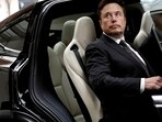 Tesla Chief Executive Officer Elon Musk gets in a Tesla car as he leaves a hotel in Beijing, China.