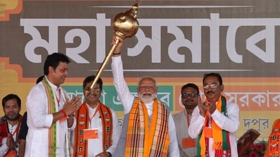 PM Narendra Modi holds up a mace during an election campaign rally in Agartala, Tripura. (Jayanta Dey / Reuters) PM Narendra Modi holds up a mace during an election campaign rally in Agartala, Tripura. (Jayanta Dey / Reuters)