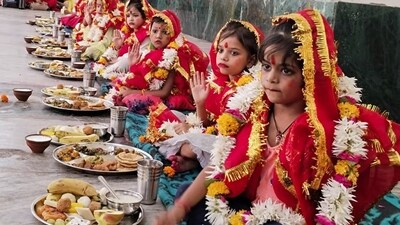 Girls eat offerings during Kanya Puja on the occasion of Ram Navami, at Baba Keenaram Darbar, in Varanasi on Wednesday. (ANI Photo) (Rajesh Kumar)